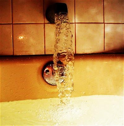 Bathtub filling with water.