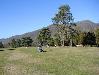 Nephew, father, brother on golf course in West Virginia.