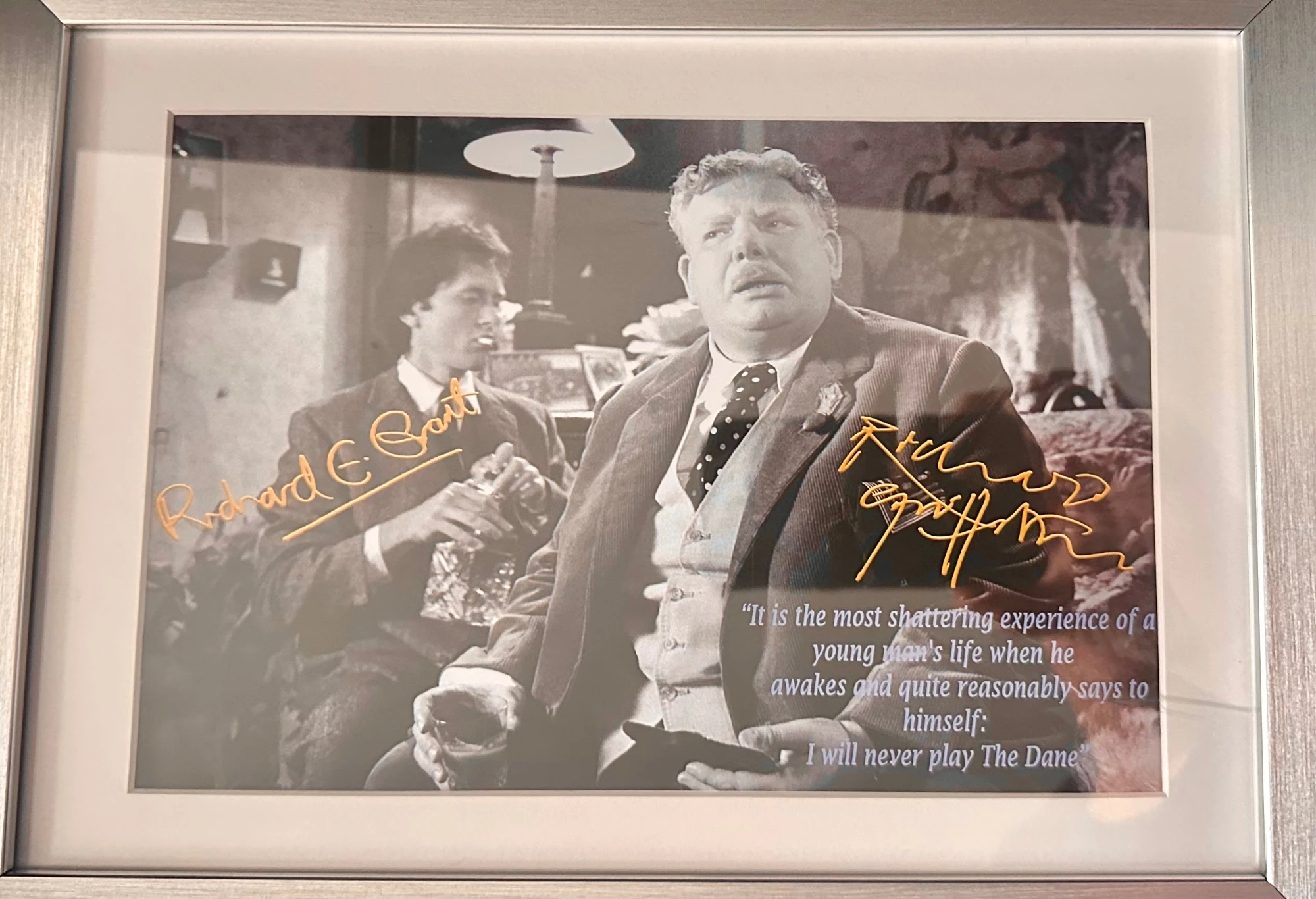 A black and white framed photo of Richard Grant and Richard Griffiths, signed in gold pen. A quote from Withal & I is printed atop Griffiths: "It's the most devastating moment in a young man's life, when he quite reasonably says to himself, 'I shall never play The Dane!'"