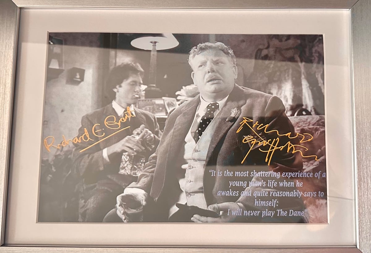 A black and white framed photo of Richard Grant and Richard Griffiths, signed in gold pen. A quote from Withal & I is printed atop Griffiths: "It's the most devastating moment in a young man's life, when he quite reasonably says to himself, 'I shall never play The Dane!'"